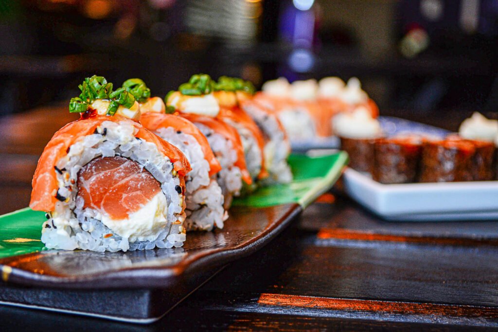 Sushi rolls on ceramic plate 